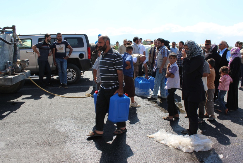 قصة مصورة: نازحو سوريا .. بين نار اللجوء وجحيم الأسد