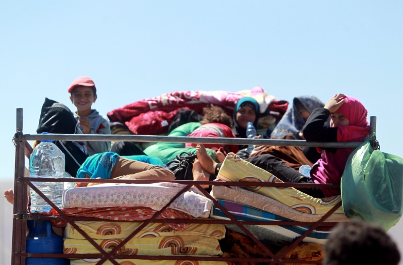 قصة مصورة: نازحو سوريا .. بين نار اللجوء وجحيم الأسد