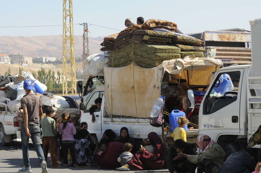 قصة مصورة: نازحو سوريا .. بين نار اللجوء وجحيم الأسد