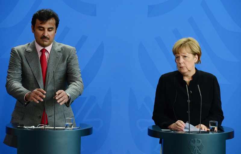 أمير قطر لـ ميركل: لا نمول الإرهاب في سوريا والعراق
