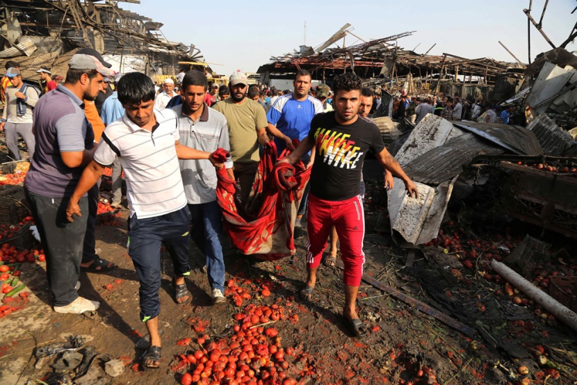 قصة مصورة: مقتل وإصابة العشرات في انفجار شاحنة مفخخة في بغداد