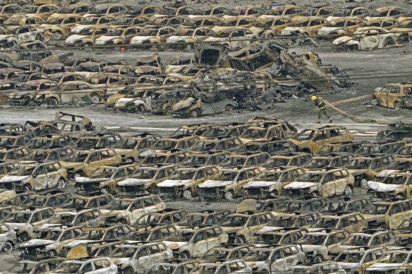 قصة مصورة: ارتفاع حصيلة قتلى انفجارات مدينة تيانجين الصينية إلى 104 شخصاً