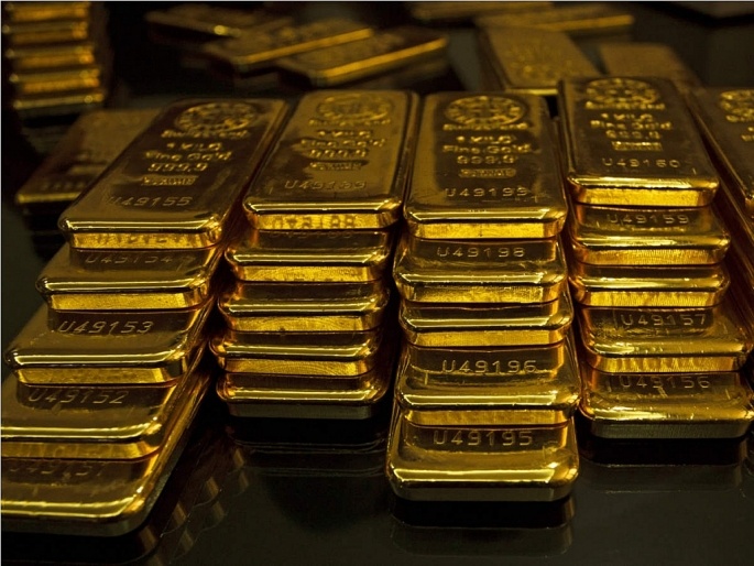 الذهب يهبط 0.3% مع صعود الدولار والفتح التدريجي للاقتصادات